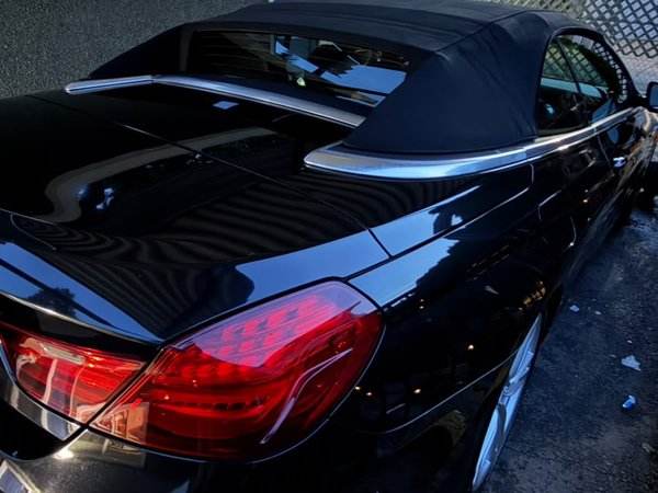 Black BMW convertible high gloss