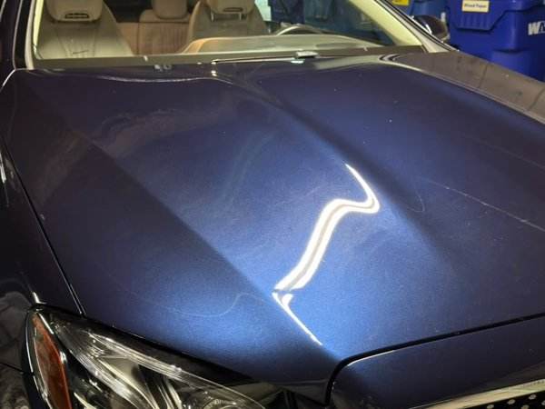 Blue Mercedes hood reflecting light